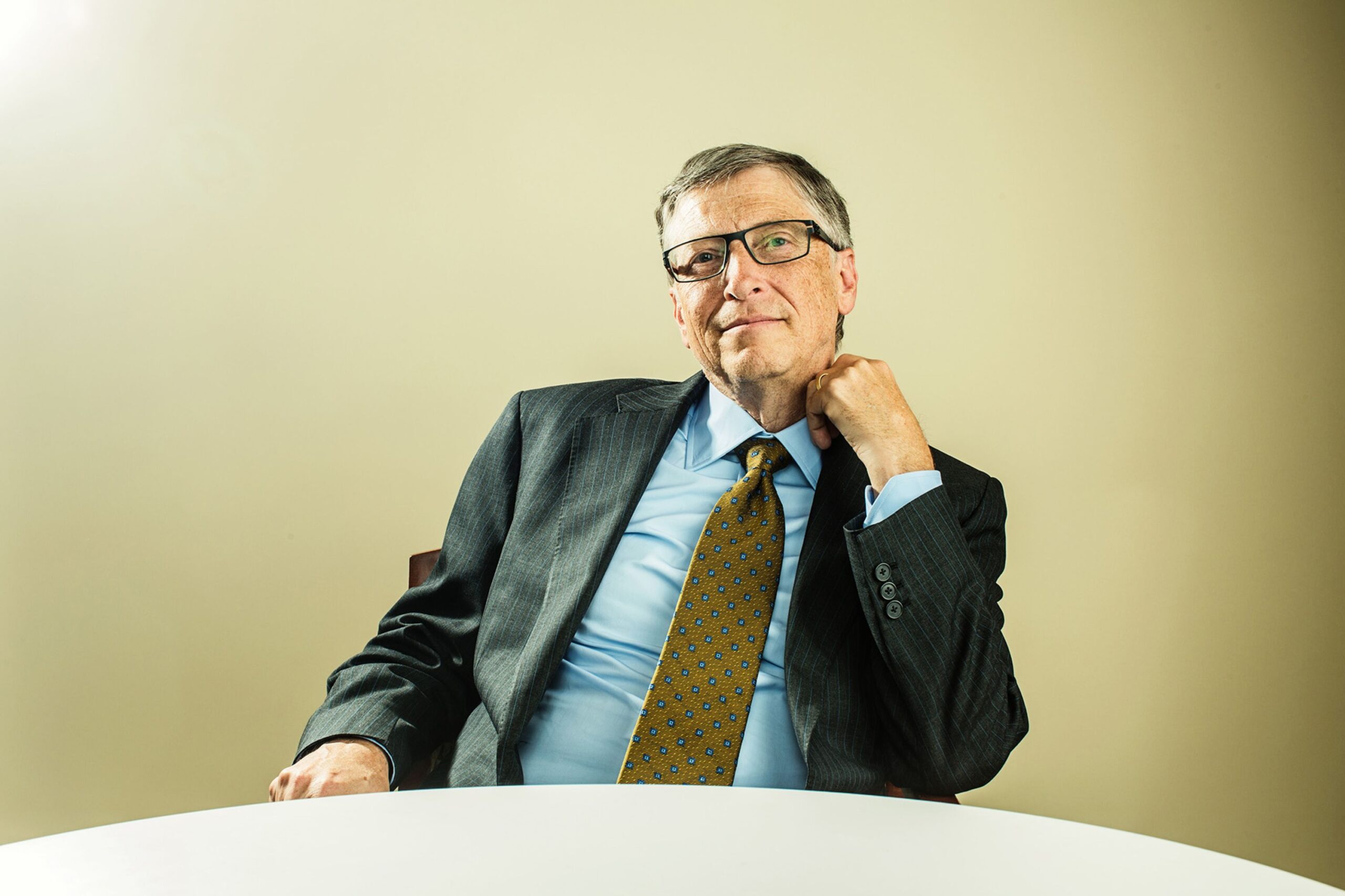 "Portrait of Bill Gates in a business setting, wearing glasses and a suit, symbolizing his legacy in technology, innovation, and global commerce supporting an article by Thomas McCorry
