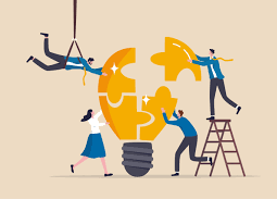 a group of professionals reassembling a lightbulb