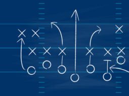 Xs and Os with arrow drawn on a sports field to signify a playbook in relation to the new brand building playbook in beverage alcohol