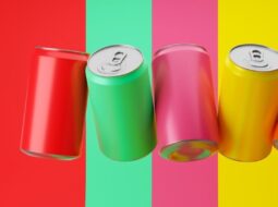 Multicolored cans on a multicolored background reflecting pricing trends and price pack architecture